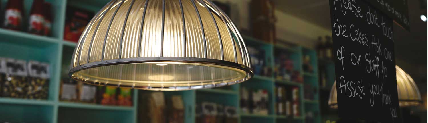 Close up of the deli light fitting with shelving in the background